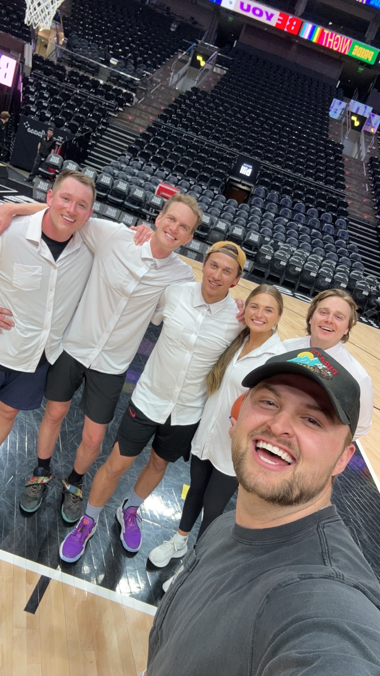 Group photo at basketball arena during sports event