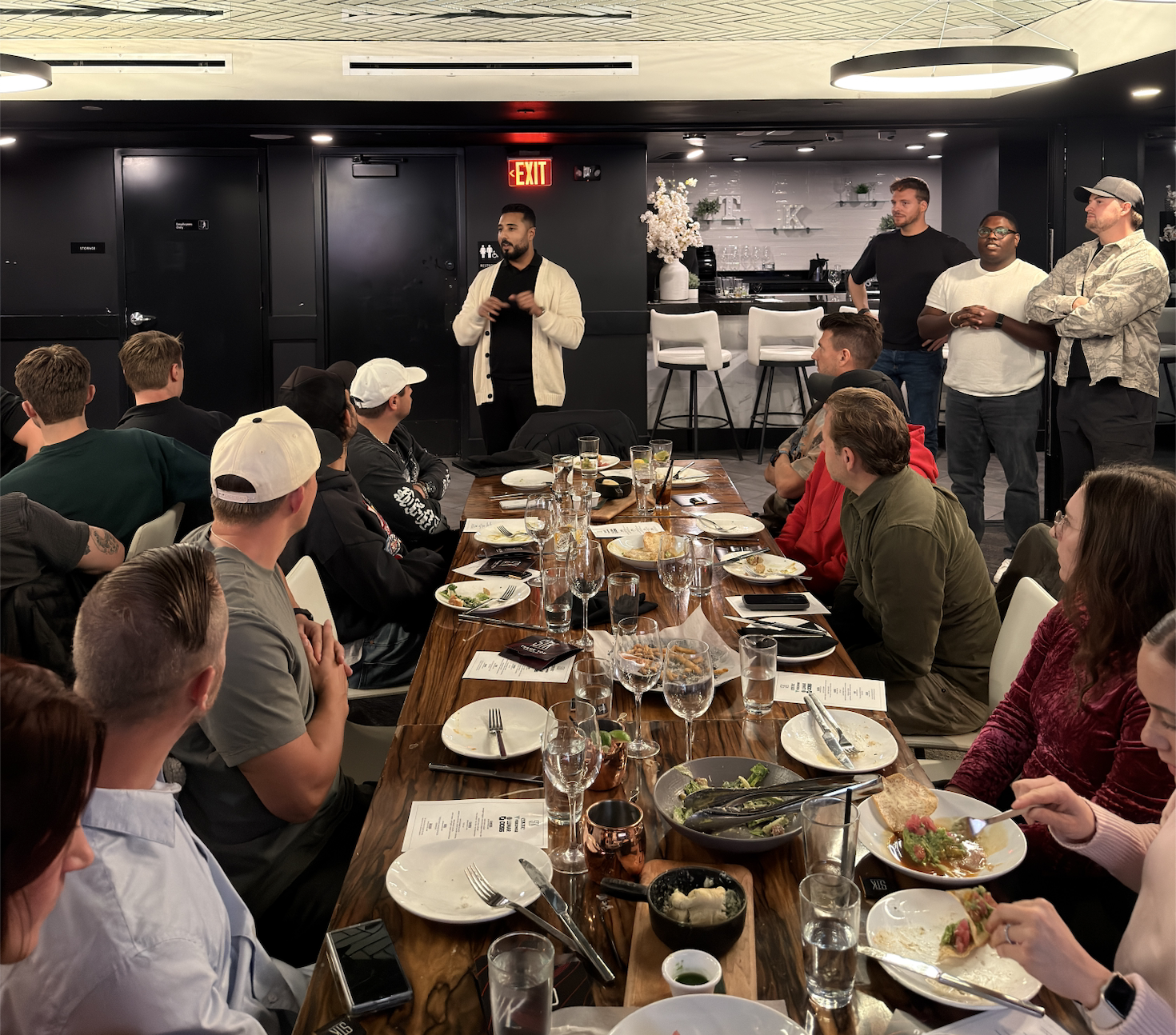 Speaking event with presentation at modern dining venue with communal table